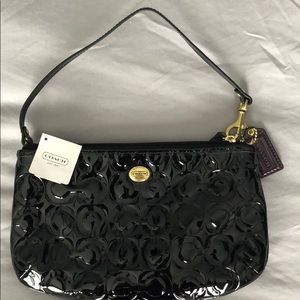 Coach wristlet/ purse. Never used. Still has tags